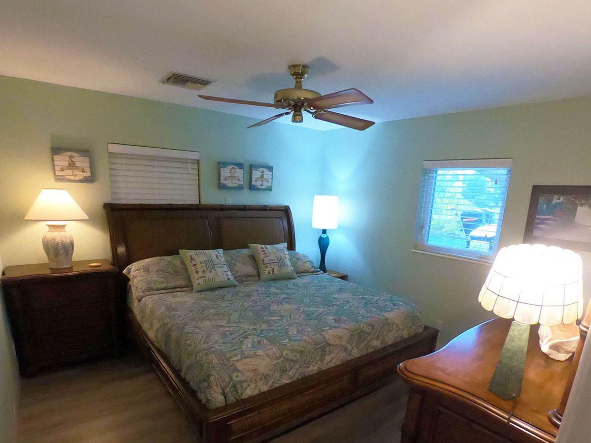 Main House Waterfront King Bedroom (Bedroom #3) is located off the Great Room and overlooks the canal